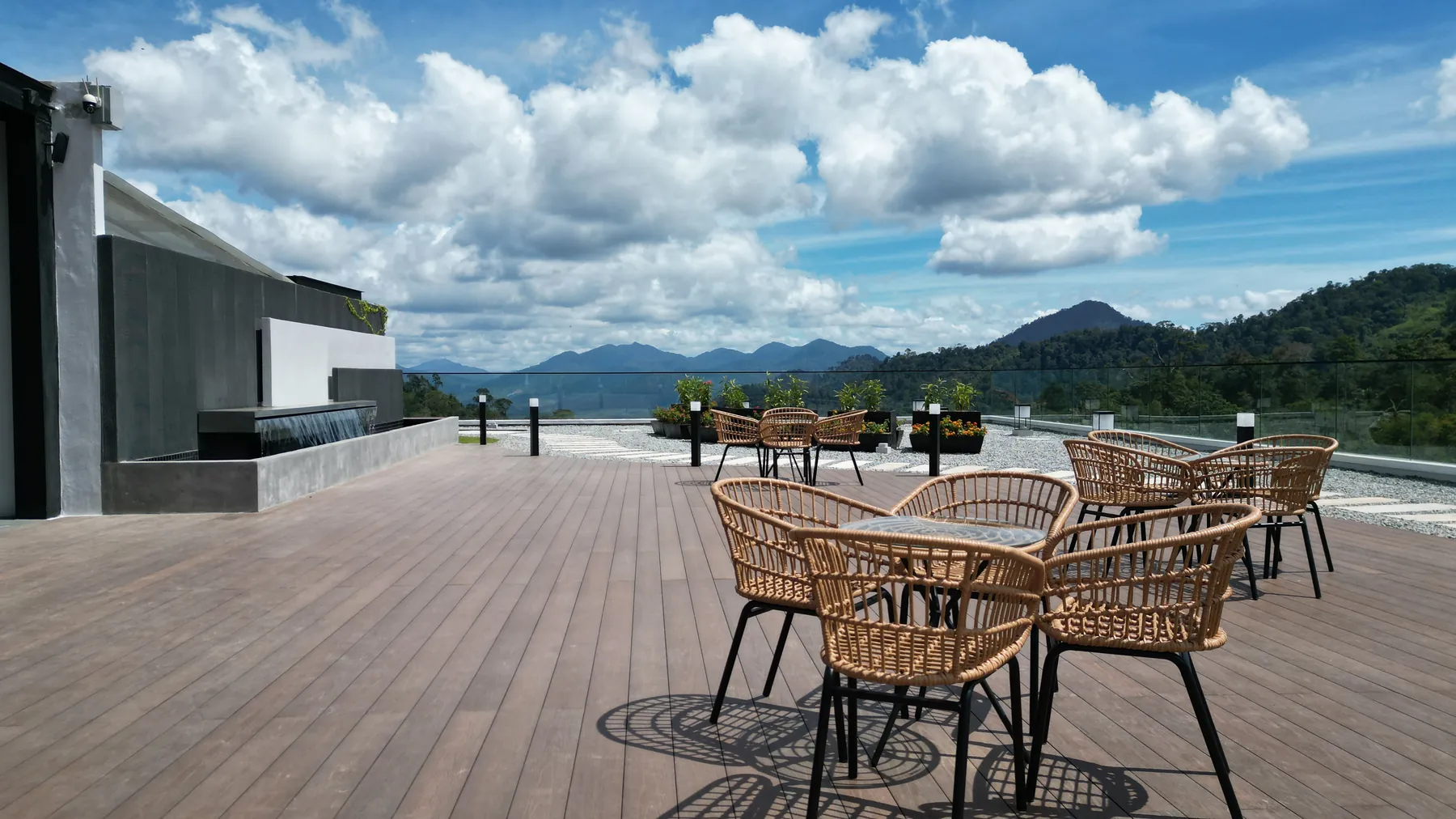 Sky deck seating with the Genting Highlands ridge on the skyline